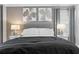 A bedroom has a padded headboard, two side tables, and artwork at 11901 4Th N St # 8207, St Petersburg, FL 33716