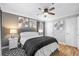 A tastefully decorated bedroom features neutral tones and hardwood floors at 11901 4Th N St # 8207, St Petersburg, FL 33716
