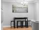Dining area featuring modern chandelier and bar-height seating for flexible dining at 11901 4Th N St # 8207, St Petersburg, FL 33716