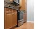 Features stainless steel oven, brown cabinets, mosaic backsplash and granite countertops at 11901 4Th N St # 8207, St Petersburg, FL 33716