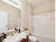 Bright bathroom featuring a shower and tub combination with neutral-toned decor at 12212 Mcmullen Loop, Riverview, FL 33569