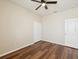 Neutral bedroom with hardwood floors, ceiling fan and a large closet at 12212 Mcmullen Loop, Riverview, FL 33569