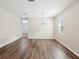 Dining room featuring hardwood floors, a chandelier, and a window for natural light at 12212 Mcmullen Loop, Riverview, FL 33569