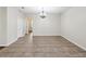 Spacious living area featuring ceramic tile and a modern chandelier at 12212 Mcmullen Loop, Riverview, FL 33569