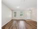 Inviting living room with wood floors, and a bright, welcoming entryway with natural light at 12212 Mcmullen Loop, Riverview, FL 33569