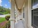 A covered front porch with columns and a view of the front yard at 12212 Mcmullen Loop, Riverview, FL 33569