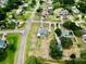 Aerial view of home with pool and fenced yard surrounded by mature trees in quiet neighborhood at 12501 Palomino Ct, Tampa, FL 33626