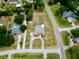 Aerial view of home with pool, circular drive and mature landscaping in a quiet neighborhood at 12501 Palomino Ct, Tampa, FL 33626