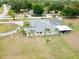 Expansive backyard features an enclosed pool area and mature palm trees, providing a private oasis at 12501 Palomino Ct, Tampa, FL 33626