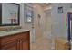Bathroom with a single sink vanity, shower-tub combo and decorated with a beach theme at 12501 Palomino Ct, Tampa, FL 33626