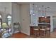 Open-concept kitchen with a breakfast bar, stainless steel appliances, and dark wood cabinetry at 12501 Palomino Ct, Tampa, FL 33626
