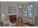 Chic living room boasting a fireplace, hardwood floors, and classic furniture arrangement at 12501 Palomino Ct, Tampa, FL 33626