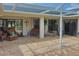 Covered patio with wicker furniture at 12501 Palomino Ct, Tampa, FL 33626