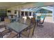 Spacious outdoor patio with ample seating and dining areas, ideal for entertaining, with views of the pool at 12501 Palomino Ct, Tampa, FL 33626