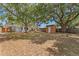 The backyard has a small shed and large trees for shade at 133 43Rd Ne Ave, St Petersburg, FL 33703