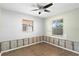 Bright bedroom with a ceiling fan and two windows providing natural light at 133 43Rd Ne Ave, St Petersburg, FL 33703