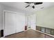 Bedroom with white closets and a doorway to another room at 133 43Rd Ne Ave, St Petersburg, FL 33703