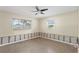 Bare bedroom with a ceiling fan and two windows providing natural light at 133 43Rd Ne Ave, St Petersburg, FL 33703