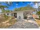 Charming single-story home with a carport and boat, complemented by beautiful landscaping and mature trees at 133 43Rd Ne Ave, St Petersburg, FL 33703