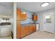 Kitchen highlighting a functional layout with cabinets and a stylish backsplash, flowing into the adjacent living space at 133 43Rd Ne Ave, St Petersburg, FL 33703