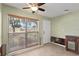Living room area with large window, offering natural light and a view of the surrounding landscape at 133 43Rd Ne Ave, St Petersburg, FL 33703