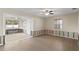 Living room featuring a ceiling fan and bright sunlight at 133 43Rd Ne Ave, St Petersburg, FL 33703