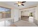 Bright living room featuring a ceiling fan and open access to other rooms at 133 43Rd Ne Ave, St Petersburg, FL 33703