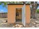 Open shed with pegboard, tools, and a sturdy door with hardware at 133 43Rd Ne Ave, St Petersburg, FL 33703
