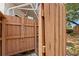 Outdoor shower behind a wooden partition with a water faucet at 133 43Rd Ne Ave, St Petersburg, FL 33703