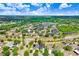 Expansive aerial view of a residential community with serene lakes, greenery and well-spaced homes at 13404 Fladgate Mark Dr, Riverview, FL 33579