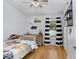 bedroom with truck theme, light hardwood floors, and a window with striped curtains at 13404 Fladgate Mark Dr, Riverview, FL 33579