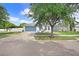 Charming single-story home with well-maintained landscaping, a blue garage door and a welcoming entrance at 13404 Fladgate Mark Dr, Riverview, FL 33579