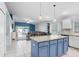 Open-concept kitchen with granite island, stainless appliances, and seamless flow into the living area at 13404 Fladgate Mark Dr, Riverview, FL 33579