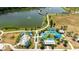 This is an aerial view showcasing the park's expansive splash pad and playground at 13916 Wellesford Way, Tampa, FL 33624