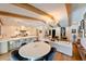 Open concept living room and kitchen with hardwood floors and modern lighting at 13916 Wellesford Way, Tampa, FL 33624