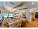 Bright and airy living room with wood beams, modern lighting, and an open concept design at 13916 Wellesford Way, Tampa, FL 33624