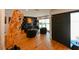 Stylish living room featuring dark shelving, fireplace, and unique decor at 13916 Wellesford Way, Tampa, FL 33624