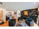 Large living room with fireplace, built-in bookcase, and artwork at 13916 Wellesford Way, Tampa, FL 33624