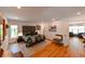Spacious main bedroom boasts a patterned bed, hardwood floors, and seating at 13916 Wellesford Way, Tampa, FL 33624
