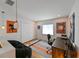 Bright office space with modern desk, decor, and natural light from the window at 13916 Wellesford Way, Tampa, FL 33624