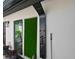 Outdoor shower with river rock and privacy wall offers a secluded oasis at 13916 Wellesford Way, Tampa, FL 33624