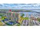 Stunning aerial view of luxury high-rise condos with marina and waterfront views at 140 Riviera Dunes Way # 1203, Palmetto, FL 34221