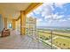 Spacious balcony with seating area and beautiful waterfront views at 140 Riviera Dunes Way # 1203, Palmetto, FL 34221