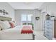 Cozy bedroom featuring a large window with waterfront views at 140 Riviera Dunes Way # 1203, Palmetto, FL 34221