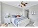 Serene bedroom featuring a decorative bed with coastal-inspired decor, and matching nightstands and lamps at 140 Riviera Dunes Way # 1203, Palmetto, FL 34221