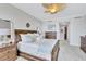 Spacious main bedroom with a ceiling fan, soft carpet, and lots of natural light at 140 Riviera Dunes Way # 1203, Palmetto, FL 34221