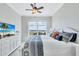 Bright main bedroom featuring a waterfront view and a decorative bed with coastal-inspired decor at 140 Riviera Dunes Way # 1203, Palmetto, FL 34221