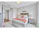 Comfortable bedroom with grey-toned walls and decorative art at 140 Riviera Dunes Way # 1203, Palmetto, FL 34221