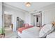 Comfortable bedroom offering ensuite bathroom access and closet space at 140 Riviera Dunes Way # 1203, Palmetto, FL 34221