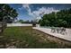 Picture of a beautiful backyard with a pool, patio, table and chairs at 1402 Oleander Dr, Tarpon Springs, FL 34689